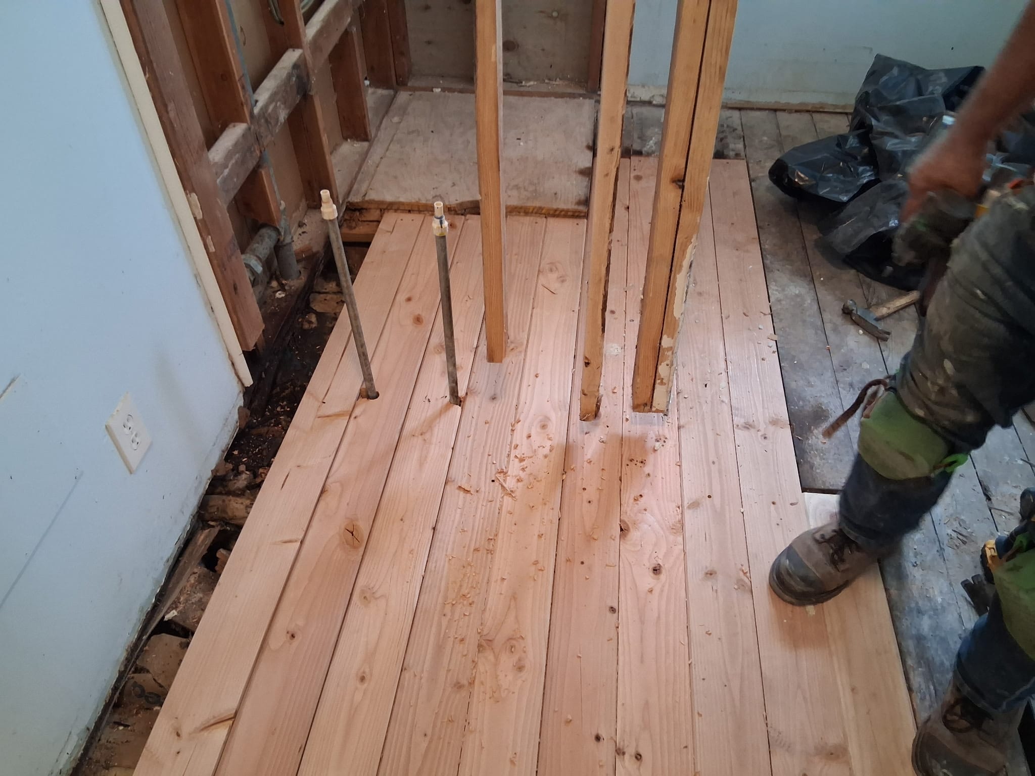 Bathroom subfloor boards going in during an interior remodel